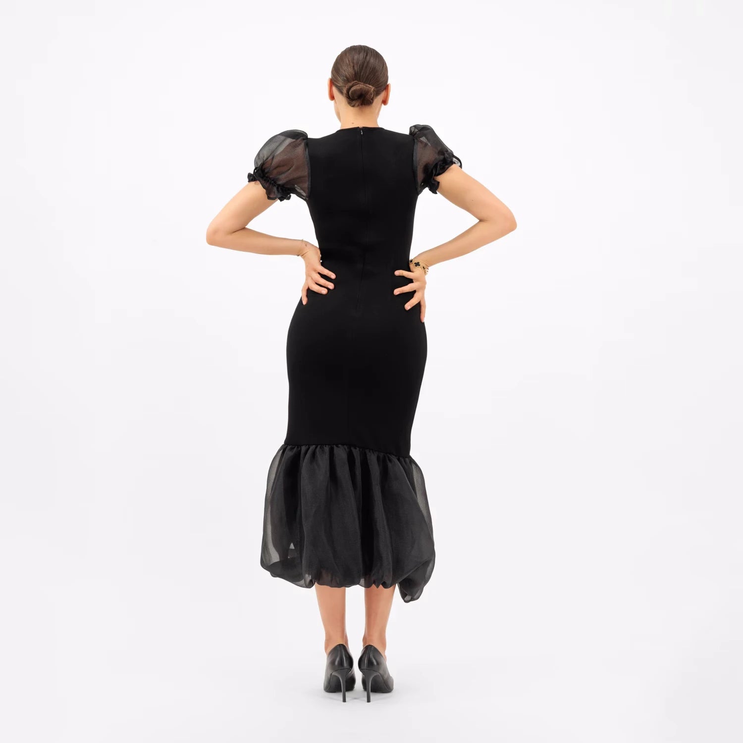 Luxury obsidian black maxi dress with sheer puff sleeves and organza hemline for refined elegance