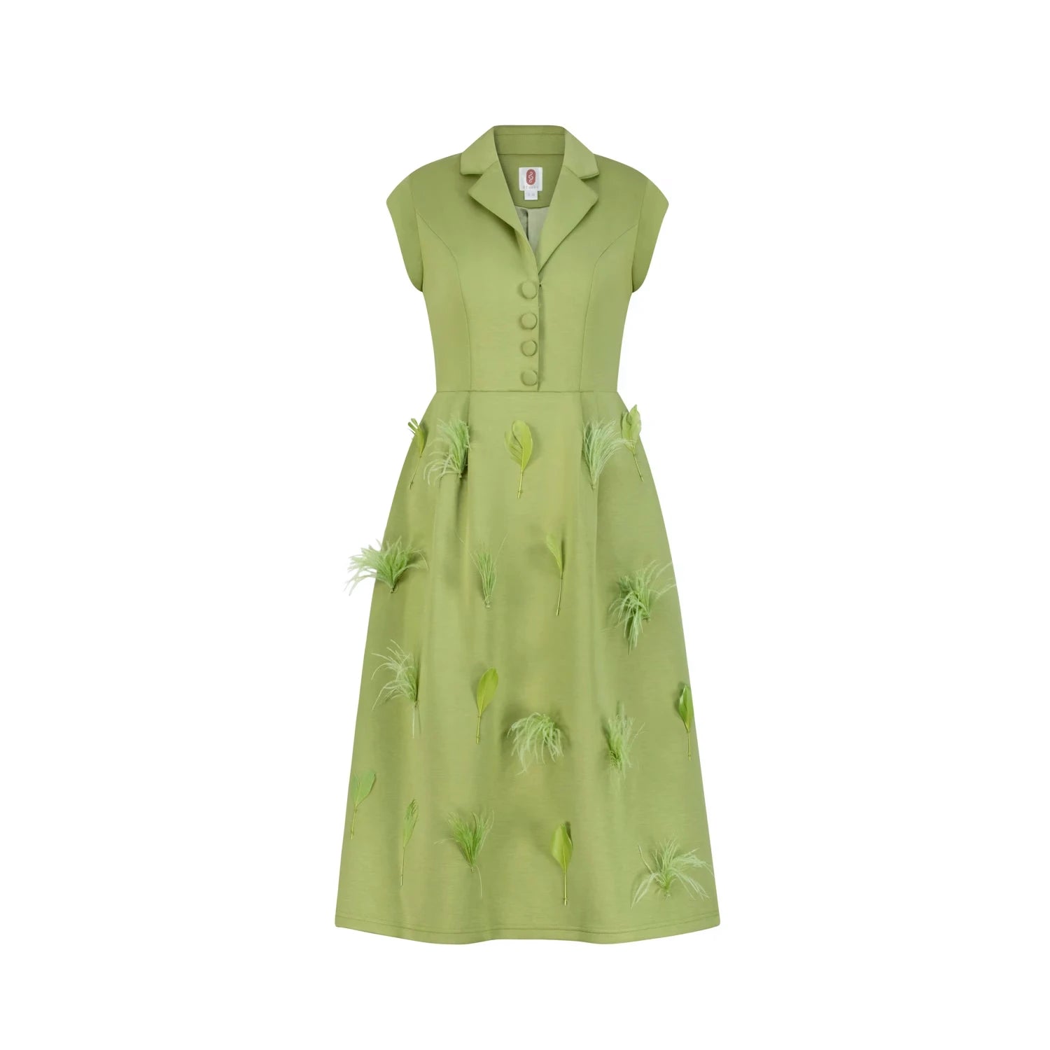 An old money style green dress with feather and leaf details.
