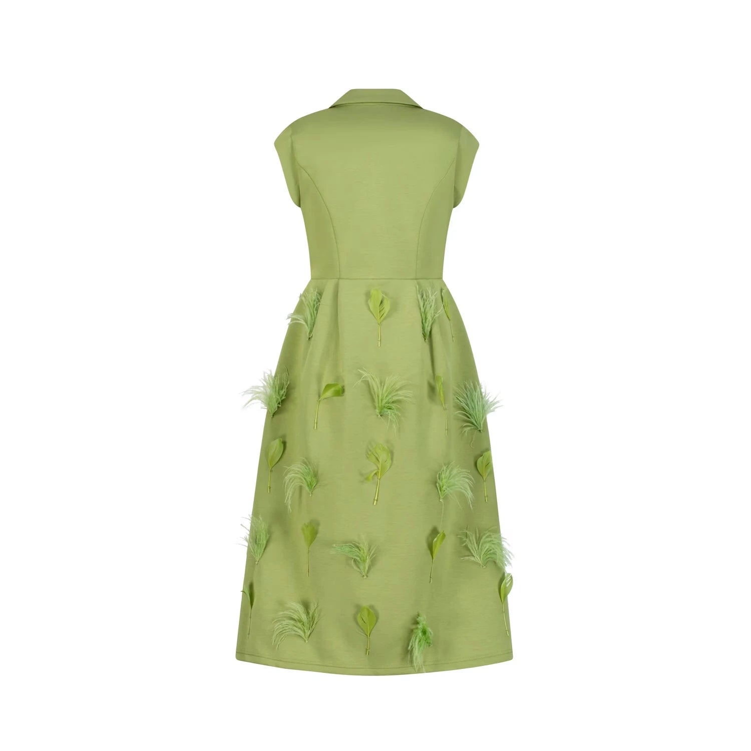 An elegant old money style pale green dress with leaf and feather appliqués.